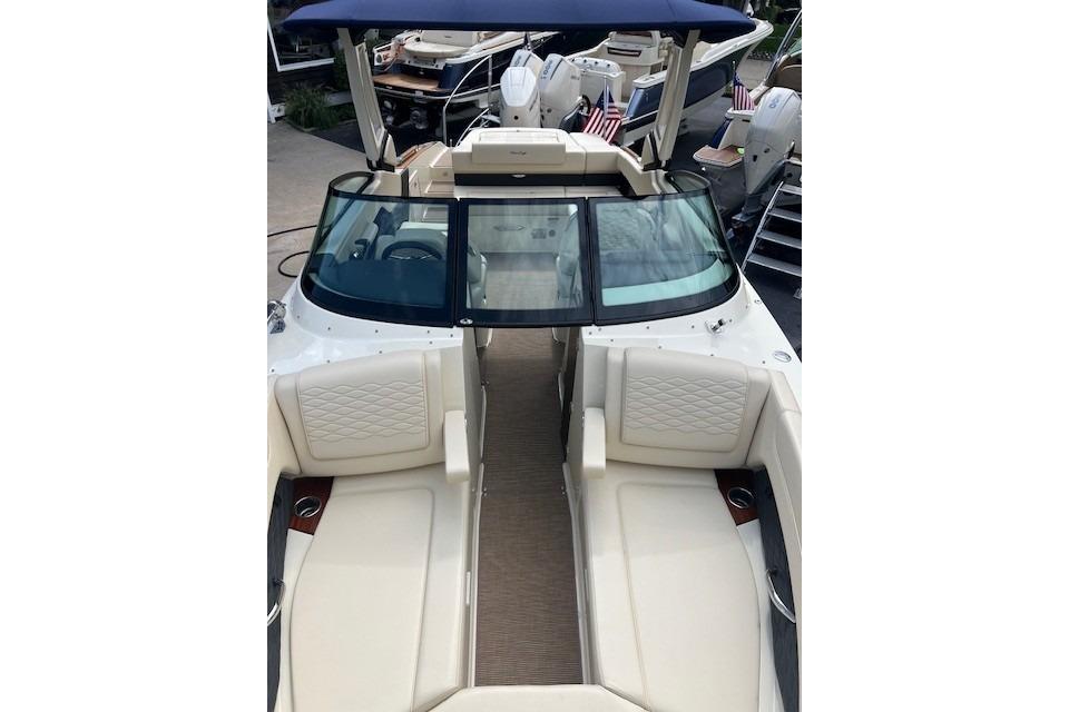 2026 Chris-Craft Sportster 28 boat with luxurious seating and sleek design.