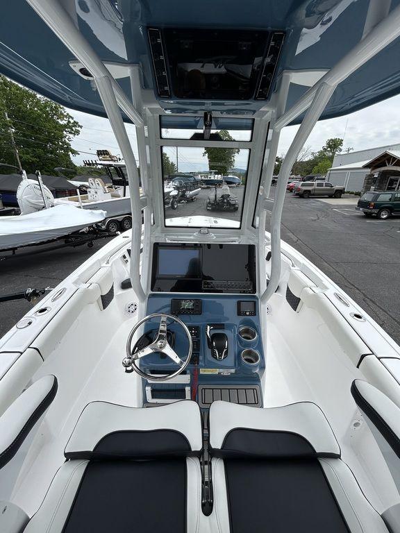 2025 Tidewater 232 LXF boat interior with modern helm and seating.