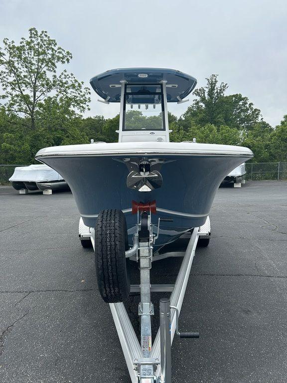 2025 Tidewater 232 LXF boat on trailer, parked outdoors.