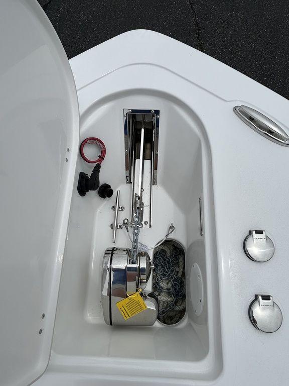 2025 Tidewater 232 LXF boat anchor compartment with chain and accessories.