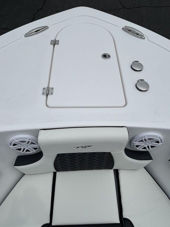 2025 Tidewater 232 LXF boat bow with storage hatch and speakers.