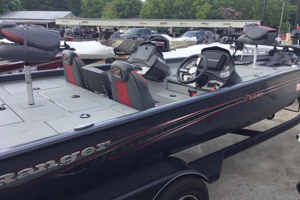 2021 Ranger RT198P fishing boat with dual seats and steering console, parked outdoors.