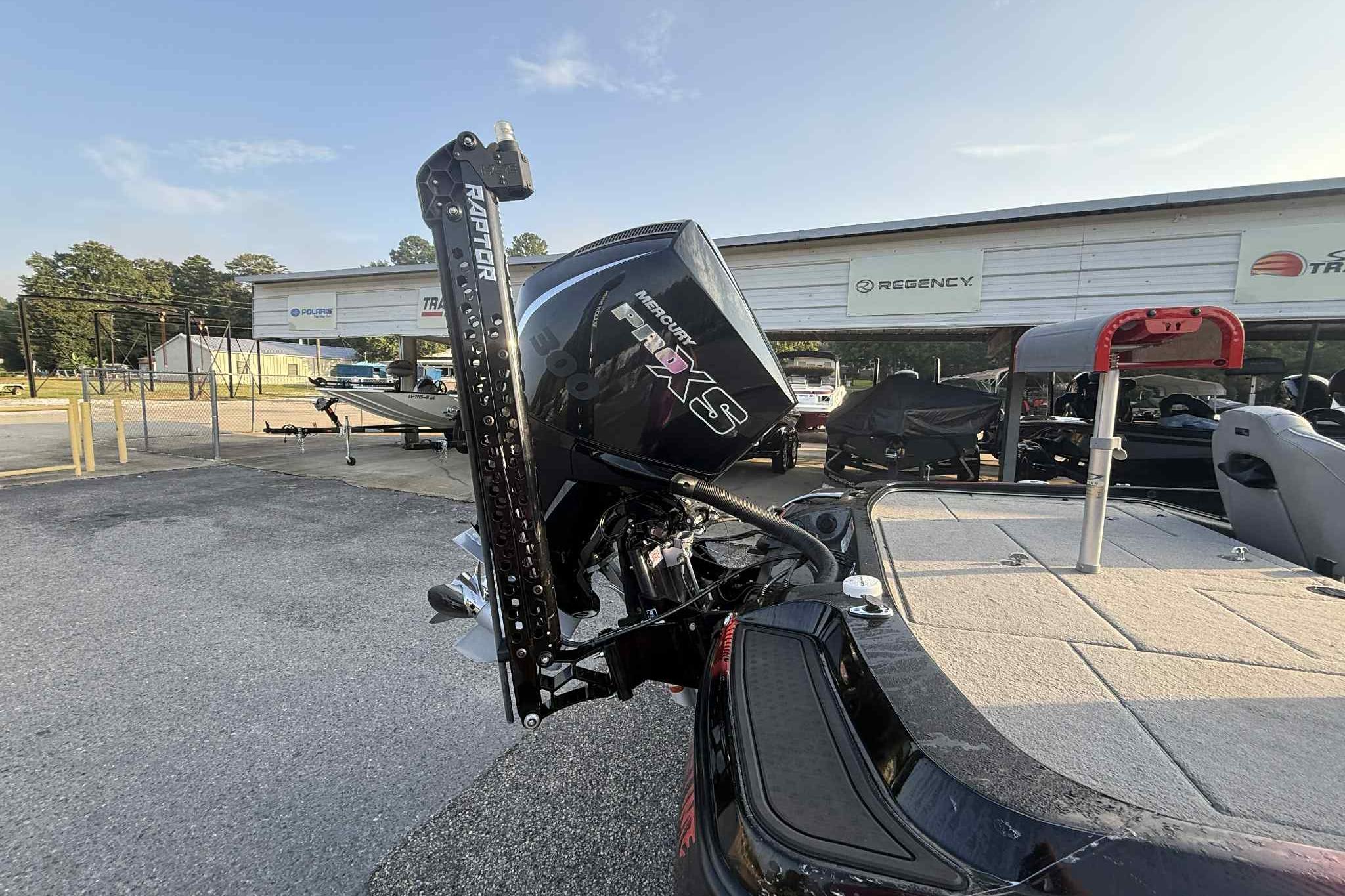 2022 Nitro Z21 XL Pro boat with Mercury engine and Raptor anchor system in a dealership lot.