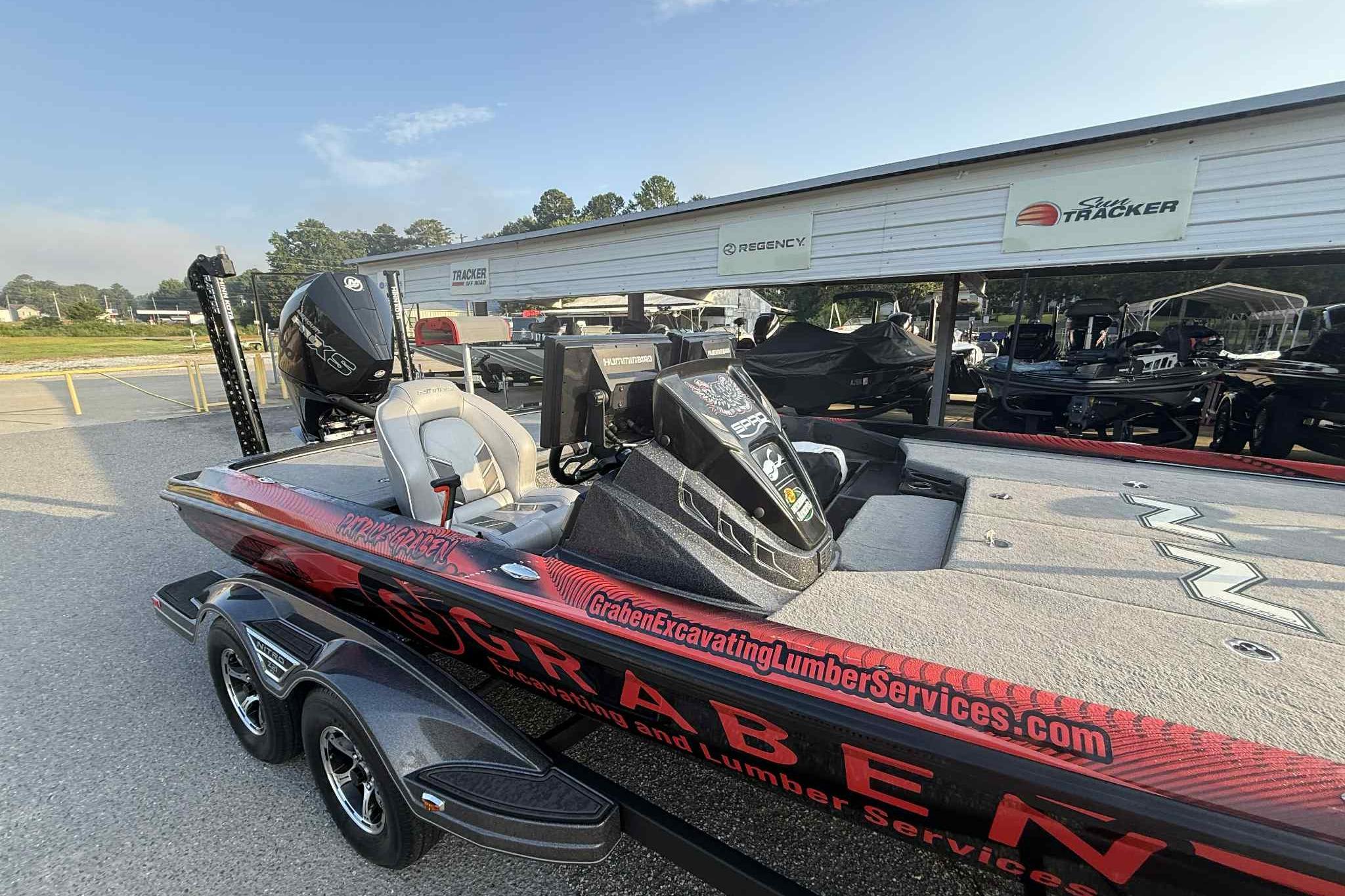 2022 Nitro Z21 XL Pro boat with custom graphics, parked at a dealership.