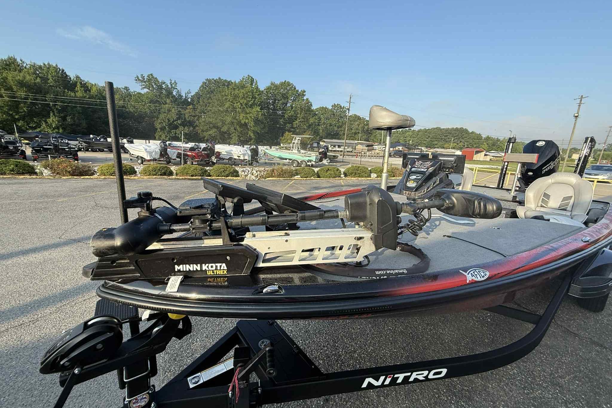 2022 Nitro Z21 XL Pro boat with Minn Kota Ultrex motor in a parking lot.