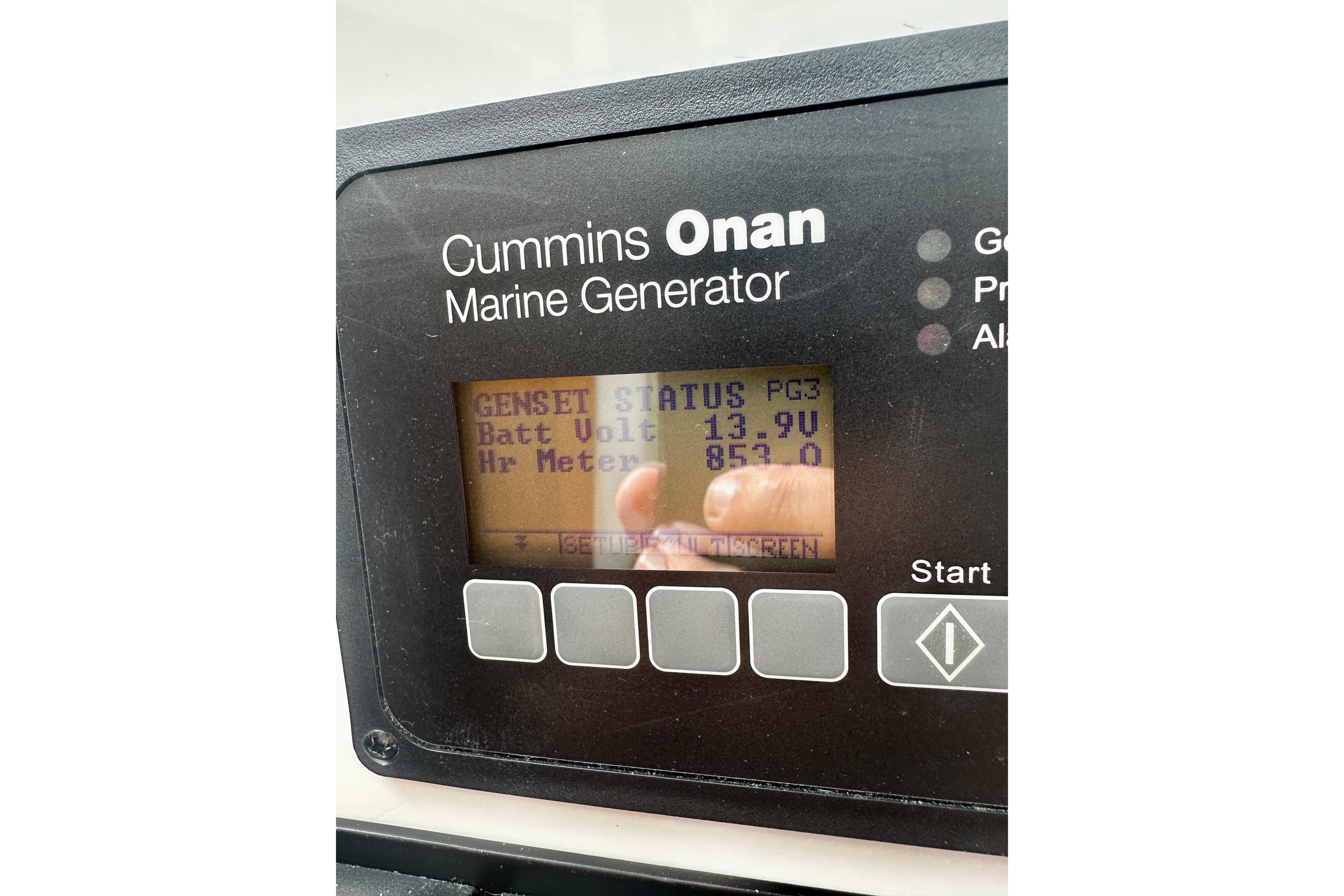 Cummins Onan marine generator display on 2019 Back Cove 37 boat, showing battery voltage.