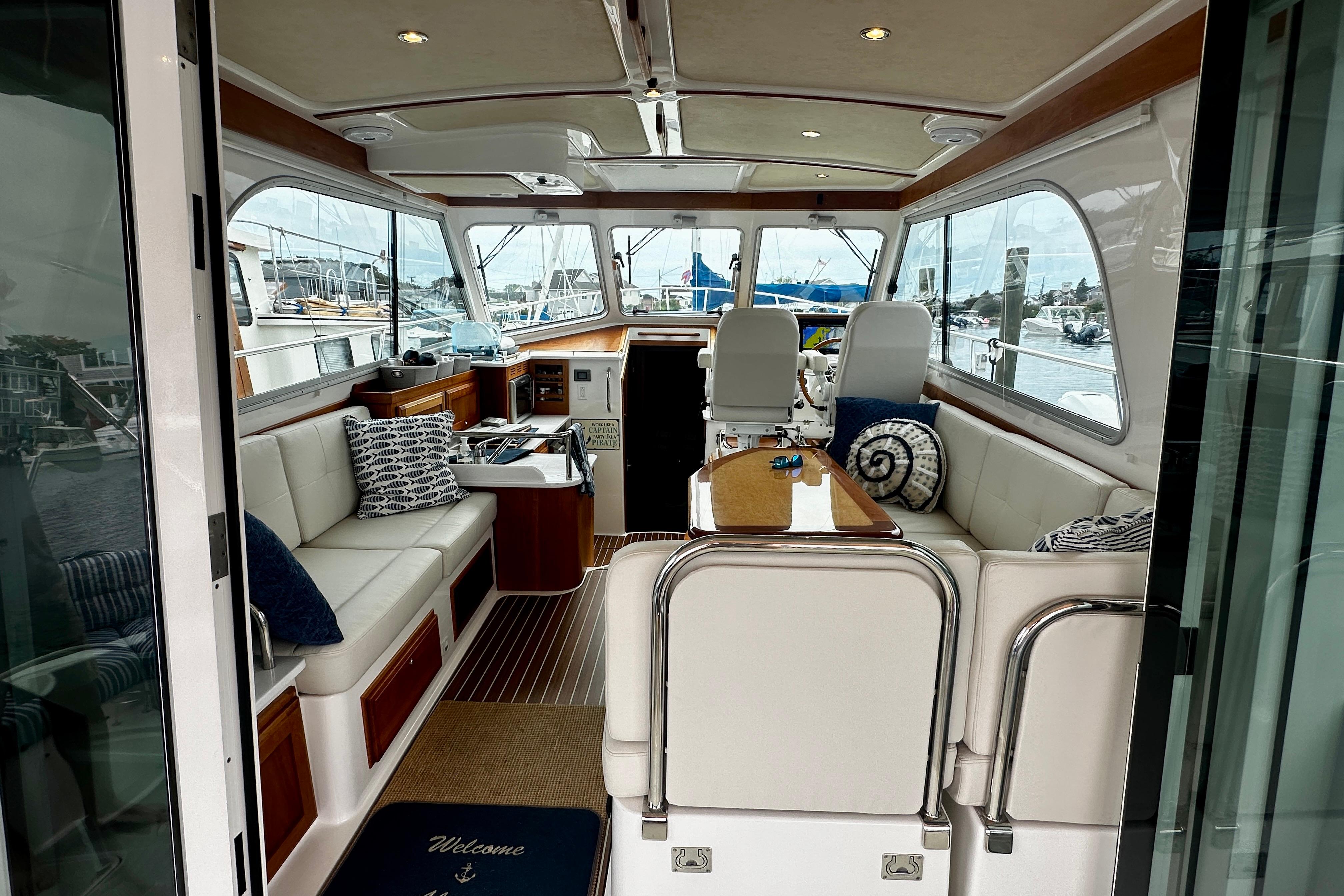 Interior of a 2019 Back Cove 37 yacht with elegant seating and nautical decor.