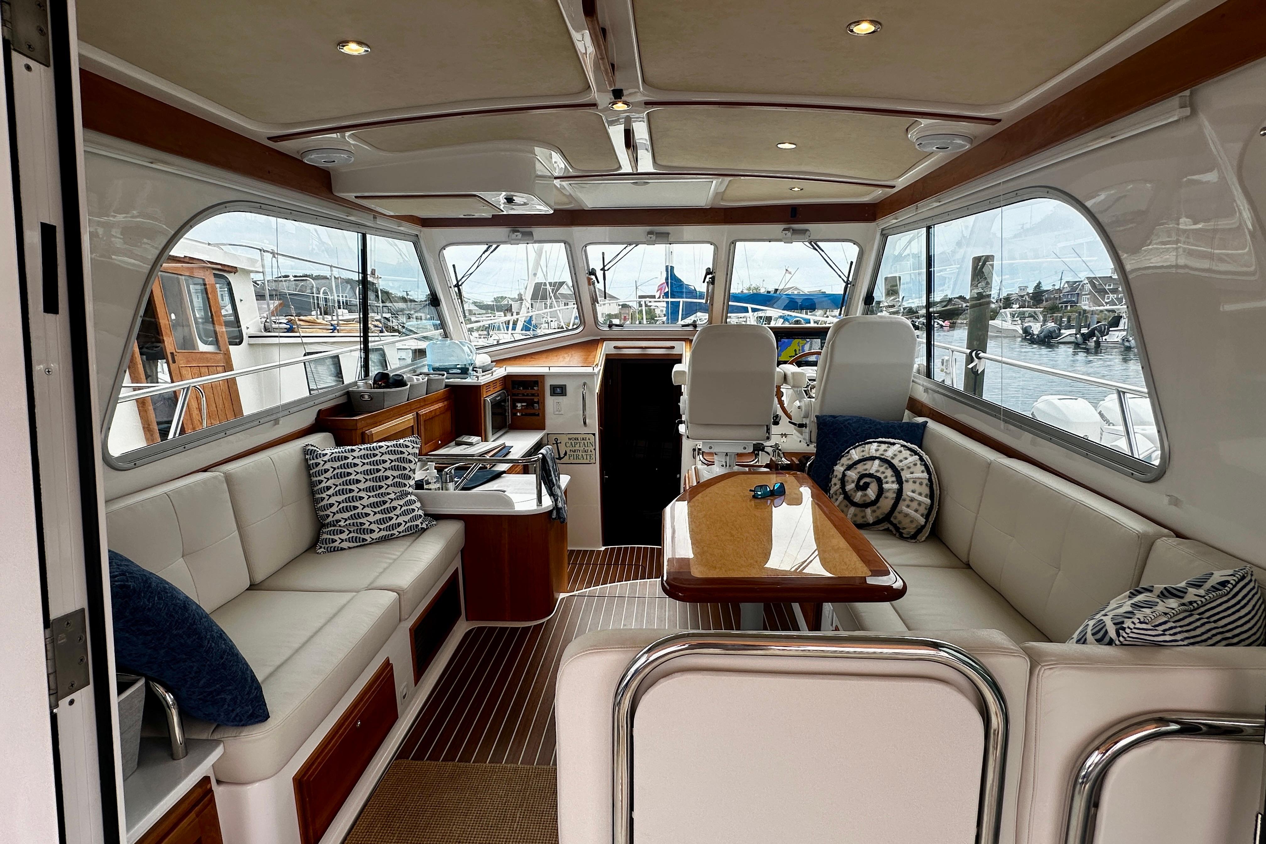 Luxurious interior of a 2019 Back Cove 37 yacht with elegant seating and nautical decor.