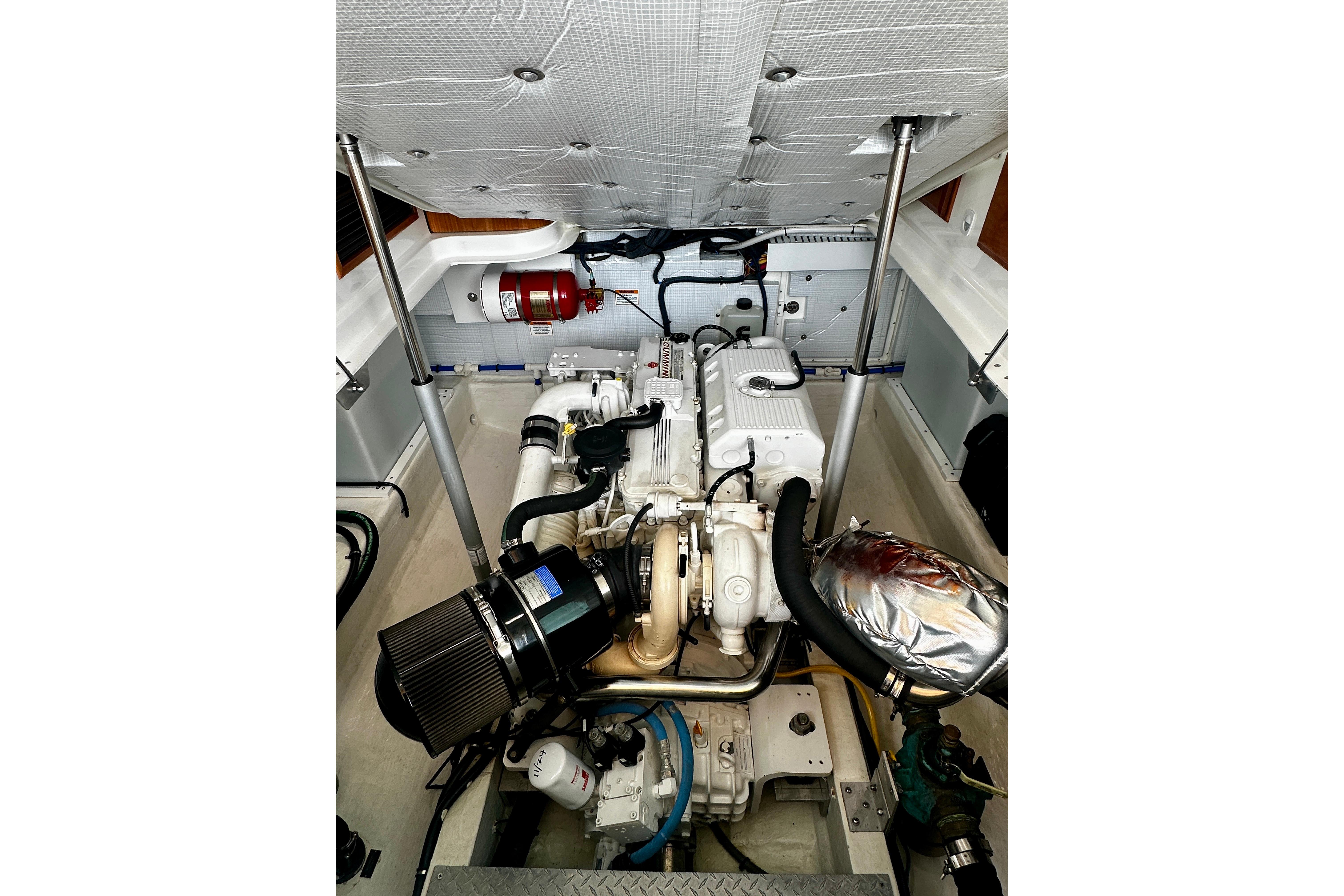 Engine compartment of a 2019 Back Cove 37 boat, showcasing detailed mechanical components.