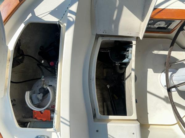 Open compartments on a 1999 Pacific Seacraft 40 Voyagemaker sailboat deck.