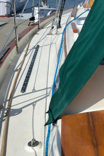 1999 Pacific Seacraft 40 Voyagemaker sailboat deck with green cover and rigging.