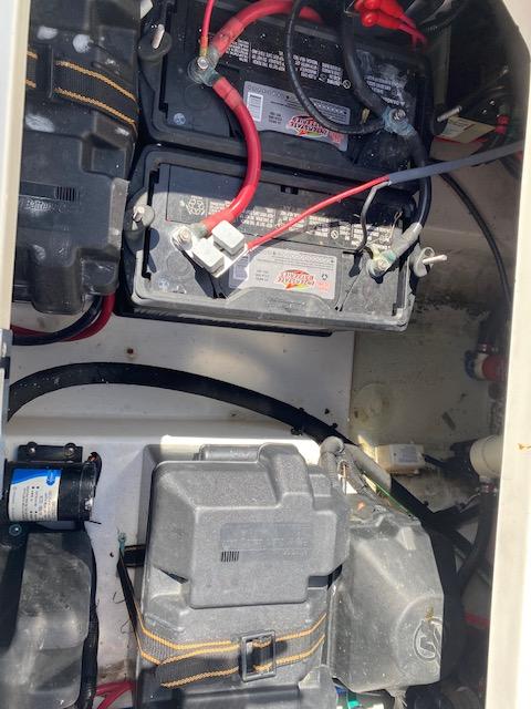 2005 Boston Whaler 275 Conquest battery compartment with wiring and components.