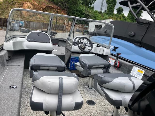 2014 Tracker Pro Guide V-16 WT boat interior with seating and steering console.