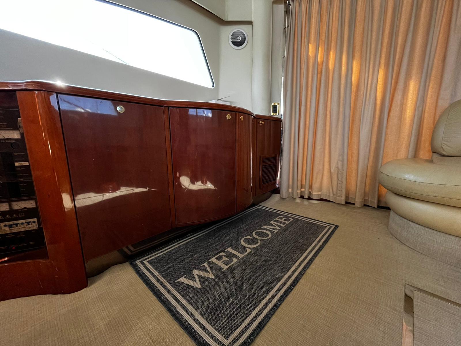 Fairline-Squadron 55 2001 -FL-US-Luxurious interior of 2001 Fairline Squadron 55 yacht with welcome mat and elegant furnishings.-9778674 | Thumbnail