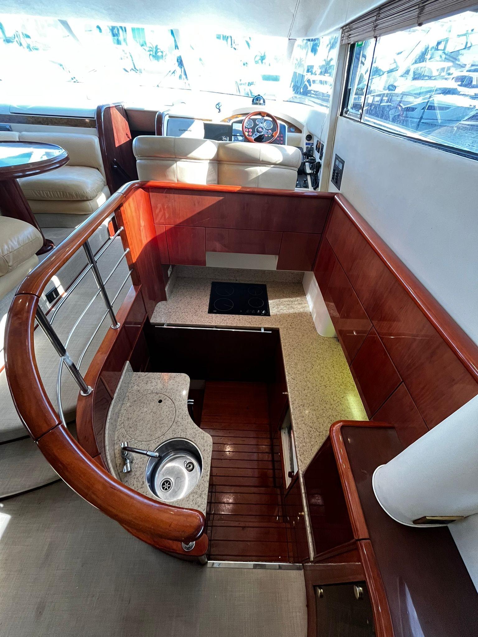 Fairline-Squadron 55 2001 -FL-US-Luxurious interior of 2001 Fairline Squadron 55 yacht with modern kitchen and seating area.-9778674 | Thumbnail