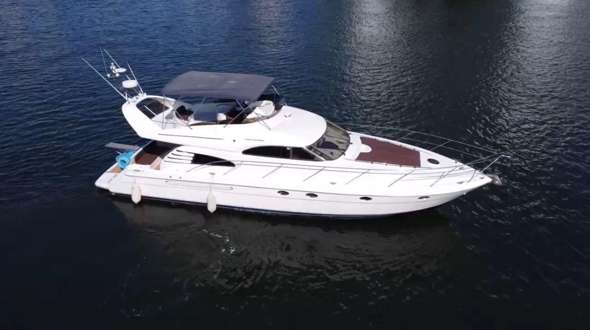 Picture of Fairline 56 ft' Squadron 55 2001 Fairline Squadron 55 yacht cruising on calm waters. 
