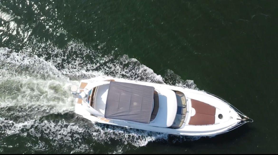 Picture of Fairline 56 ft' Squadron 55 Aerial view of 2001 Fairline Squadron 55 yacht cruising on water. 