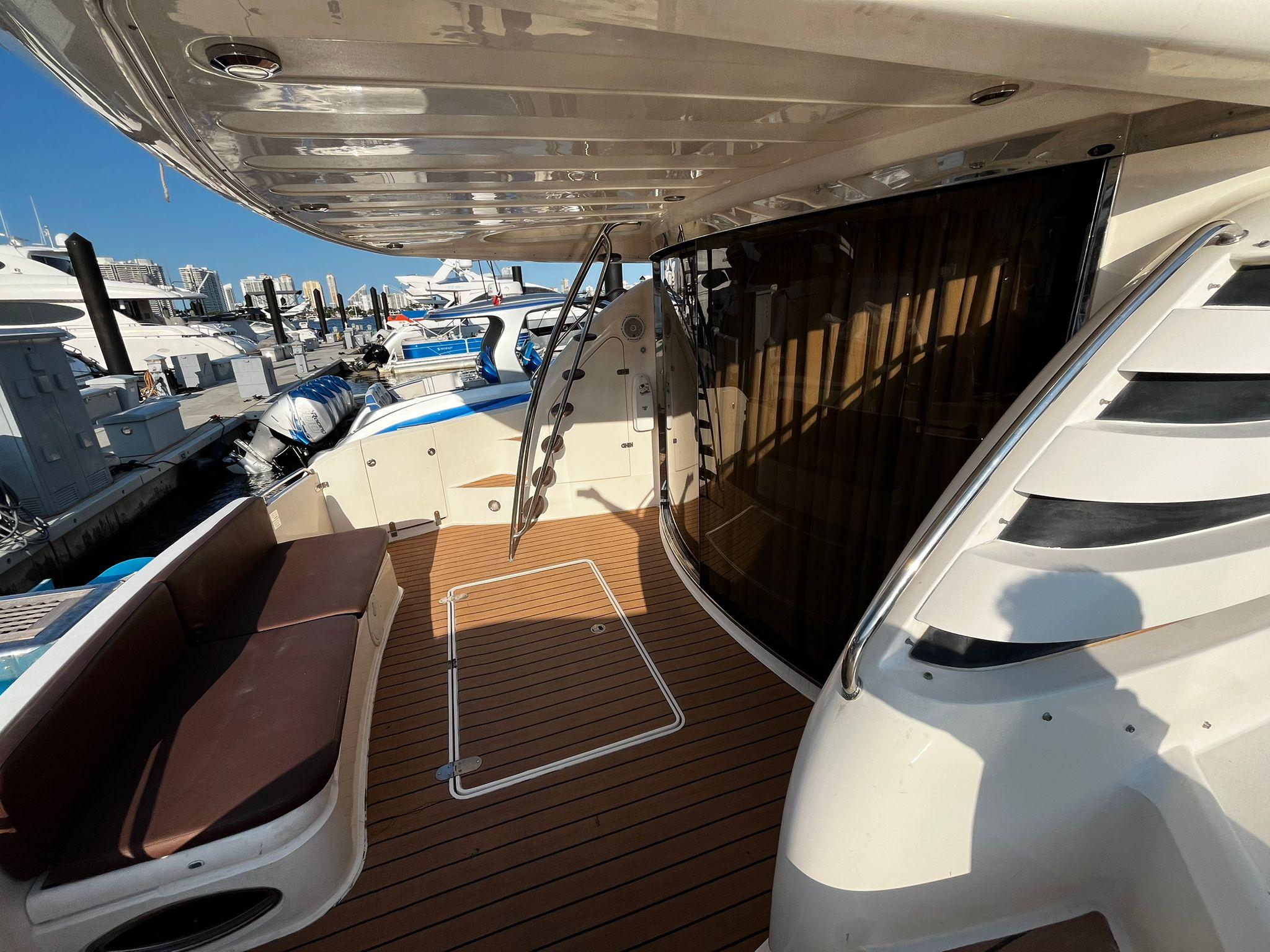 Fairline-Squadron 55 2001 -FL-US-2001 Fairline Squadron 55 yacht deck with seating, docked at marina.-9778674 | Thumbnail