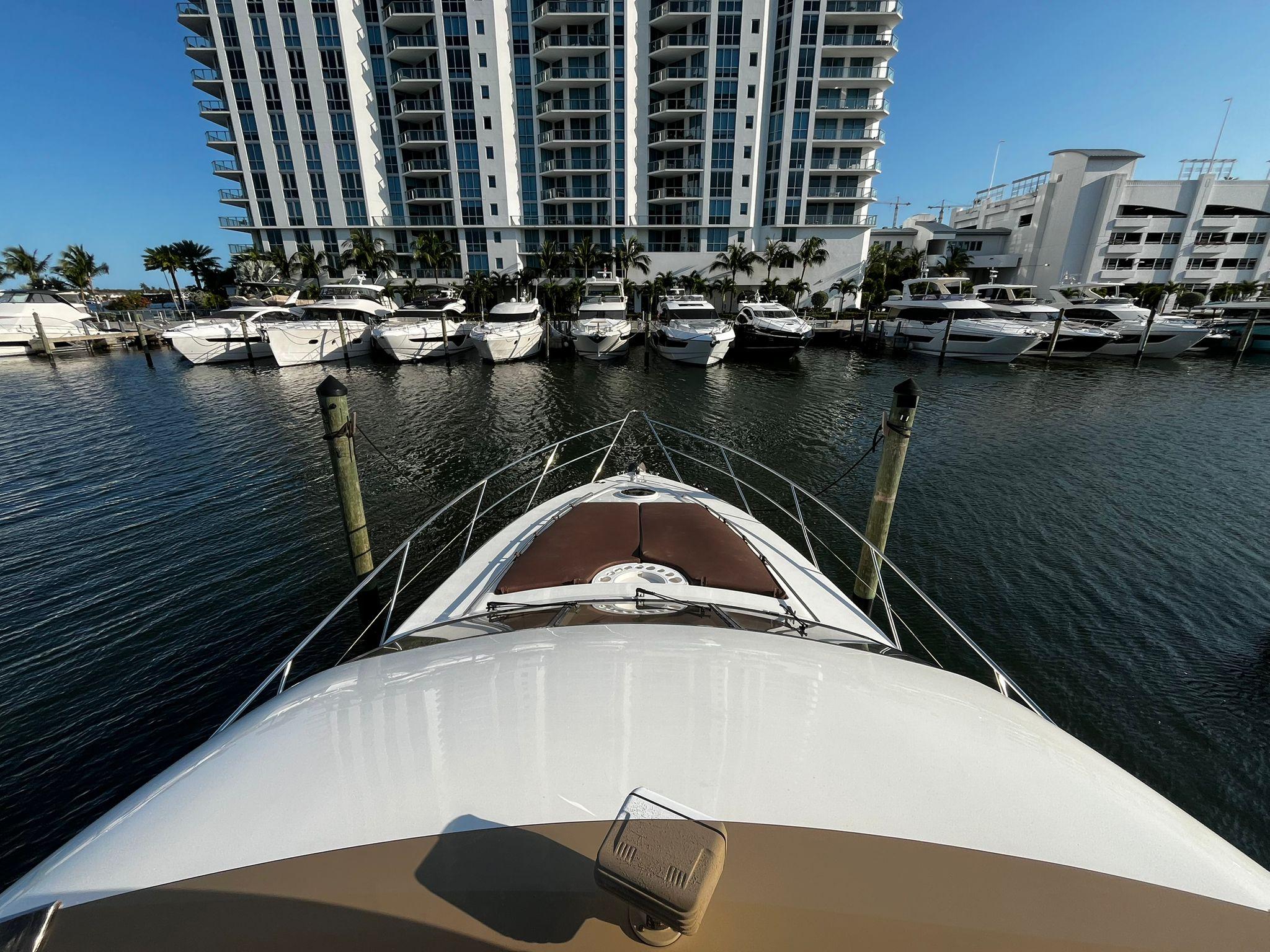 Fairline-Squadron 55 2001 -FL-US-Bow view of 2001 Fairline Squadron 55 yacht docked near luxury waterfront buildings.-9778674 | Thumbnail