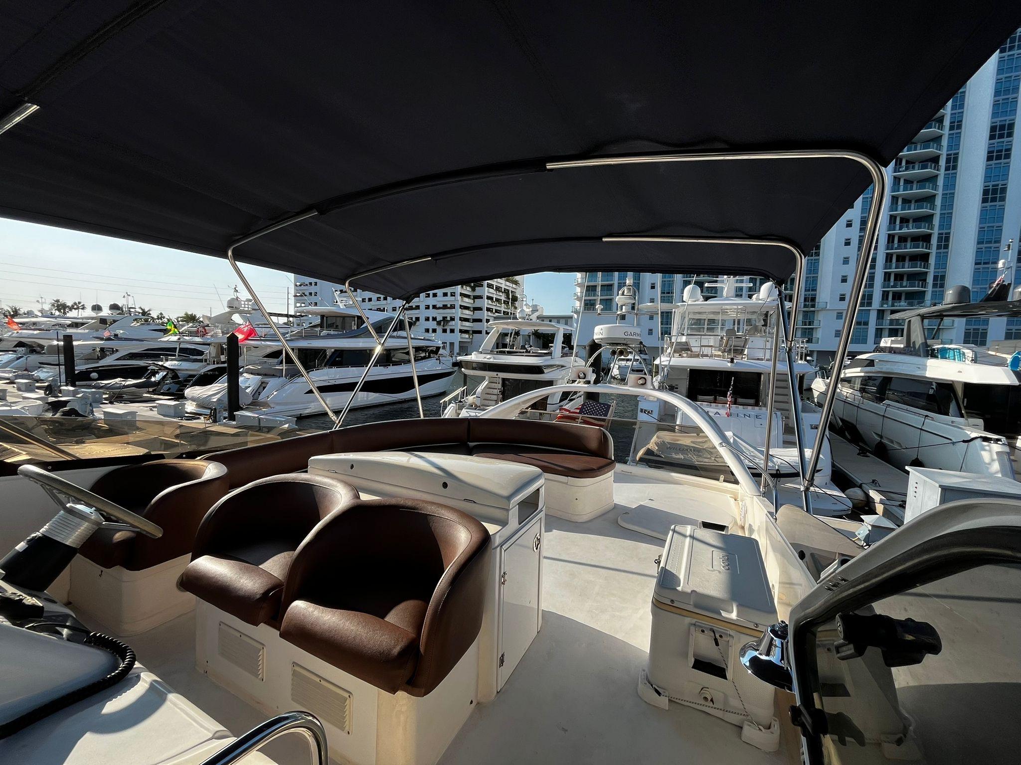 Fairline-Squadron 55 2001 -FL-US-2001 Fairline Squadron 55 yacht interior with seating, docked at a marina.-9778674 | Thumbnail
