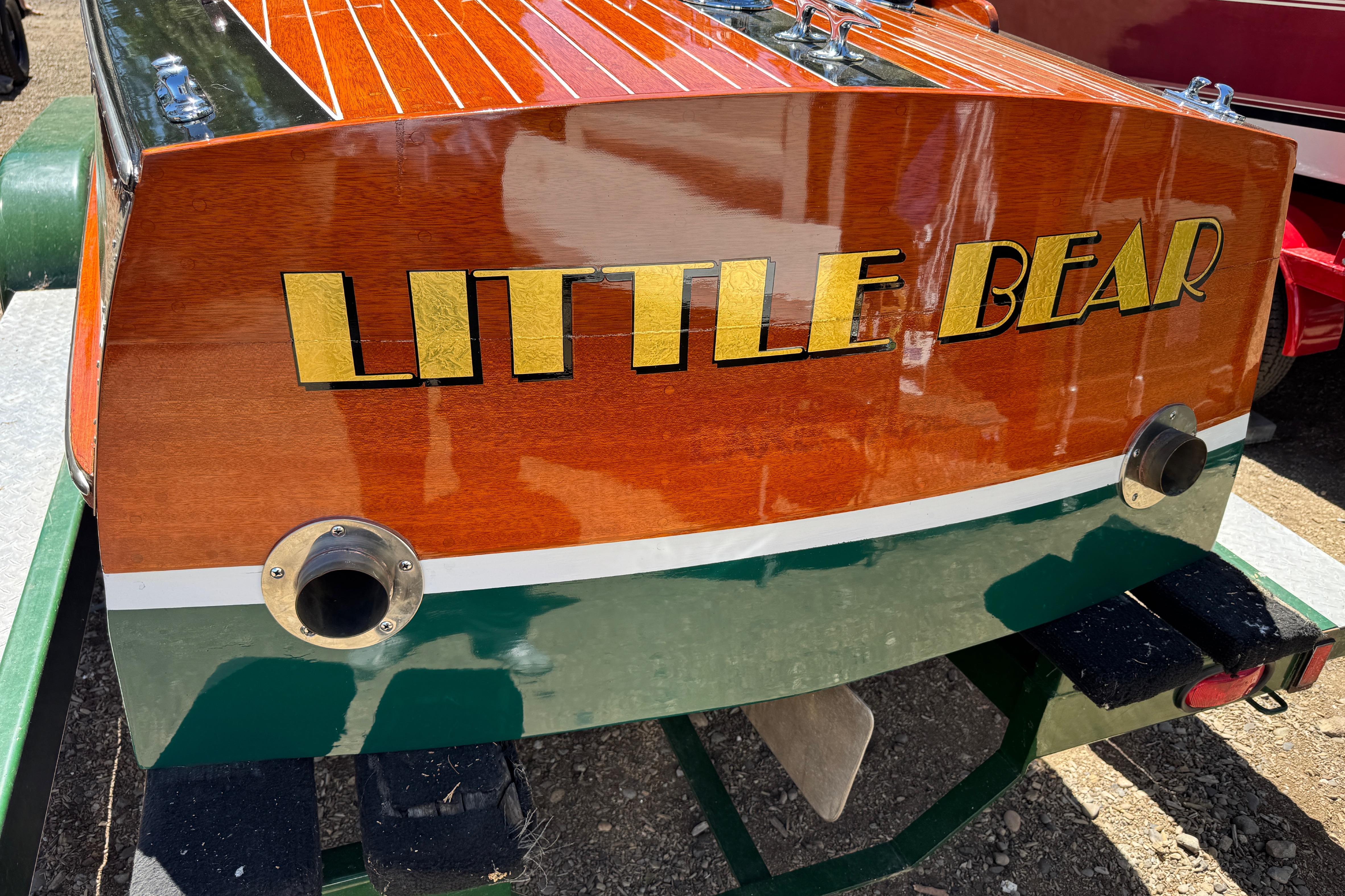 1987 Grand Craft Triple Cockpit Runabout, "Little Bear," with polished wood finish.