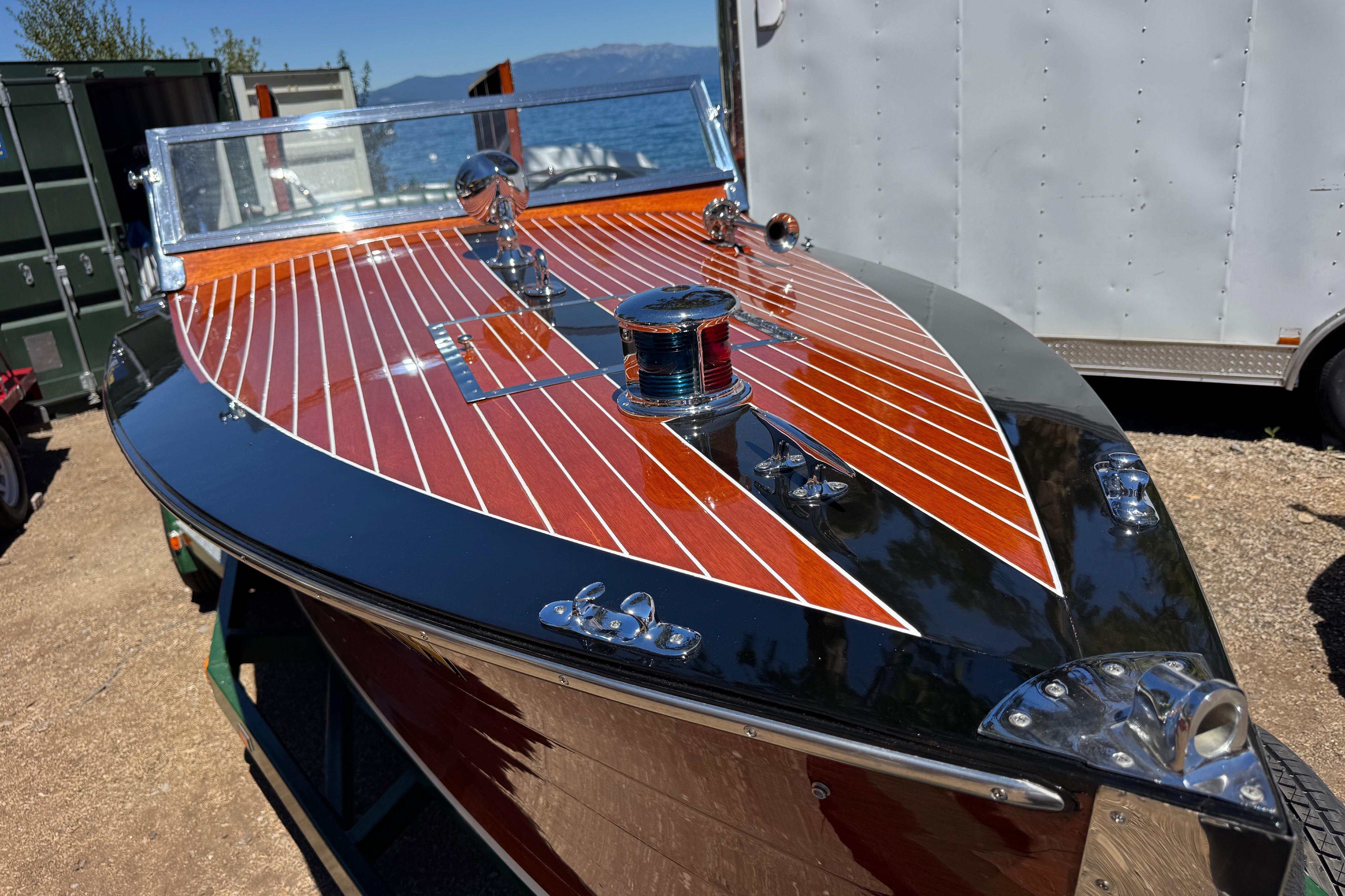 1987 Grand Craft Triple Cockpit Runabout with polished wood finish and chrome details.