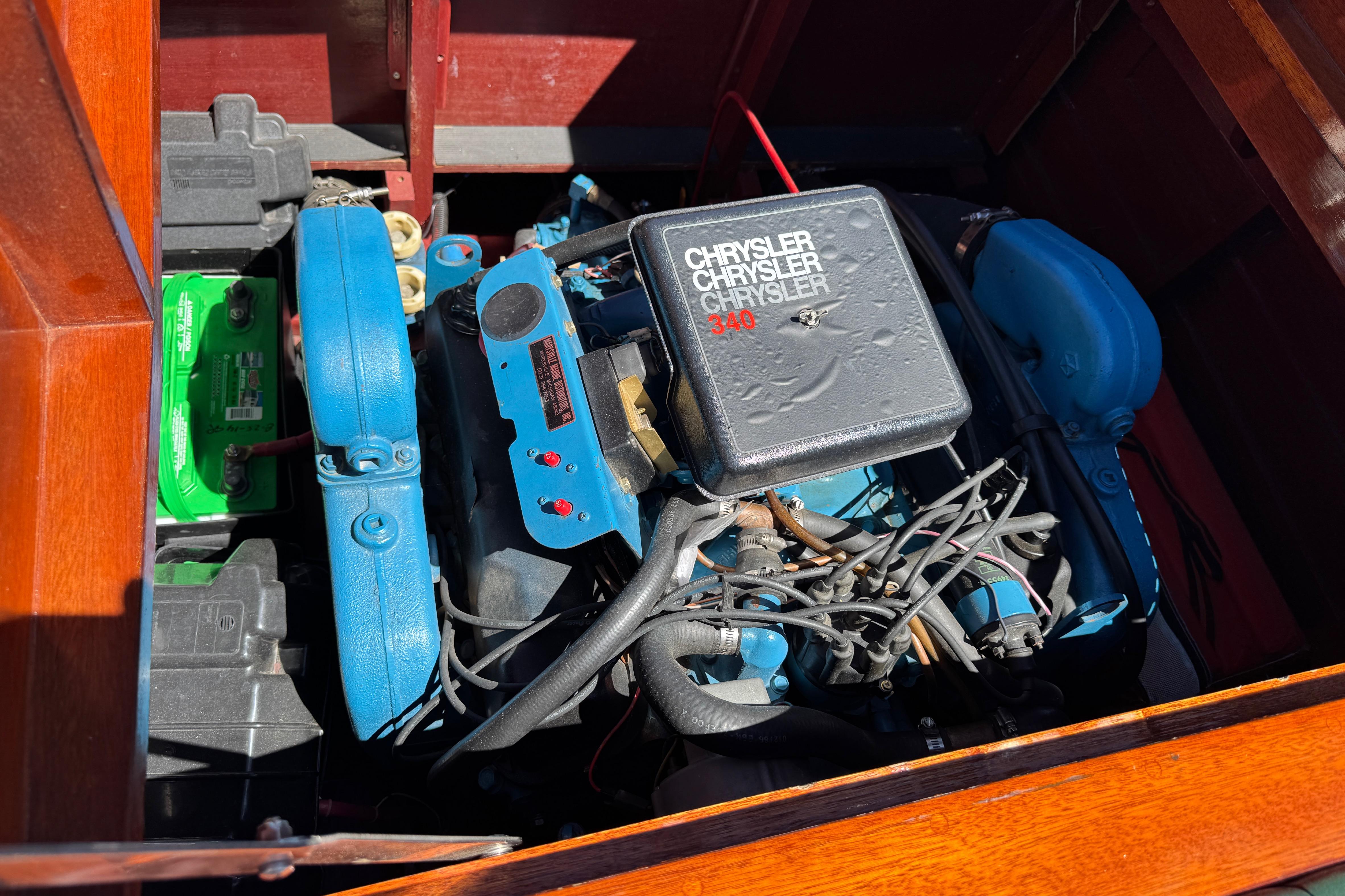 Engine of 1987 Grand Craft Triple Cockpit Runabout with Chrysler 340 V8.