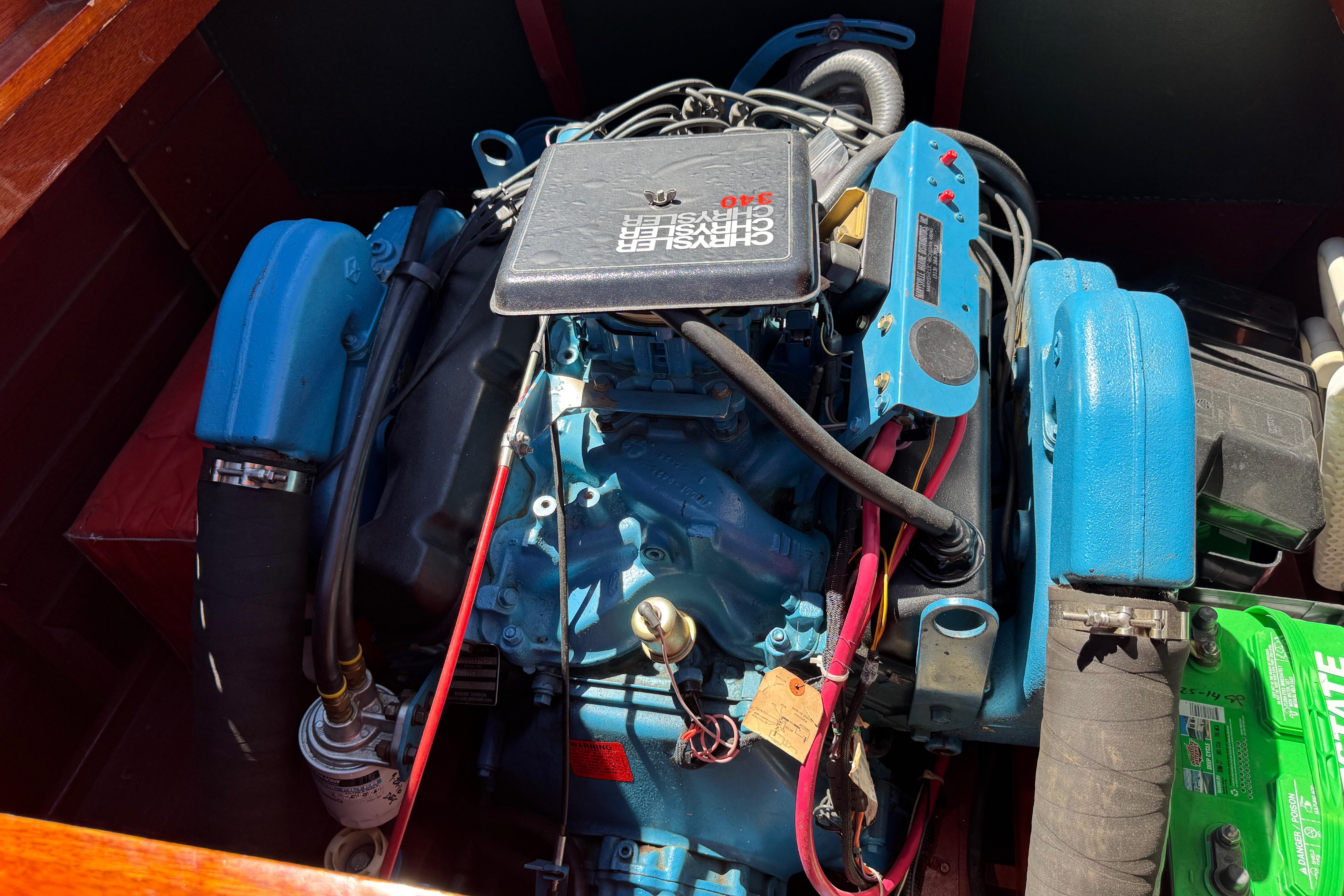 Engine of a 1987 Grand Craft Triple Cockpit Runabout, showcasing detailed components.