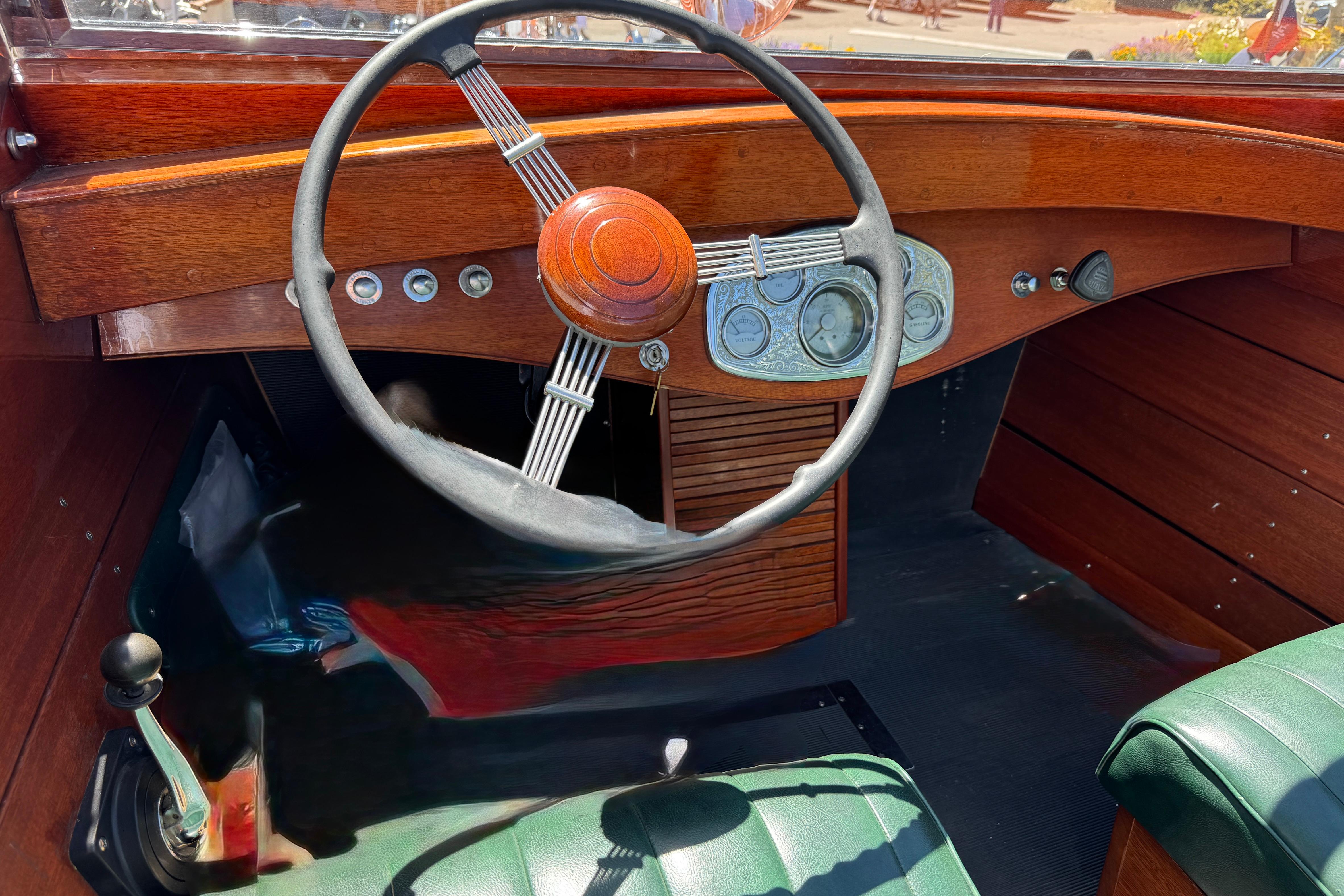 1987 Grand Craft Triple Cockpit Runabout interior with wooden dashboard and vintage steering wheel.