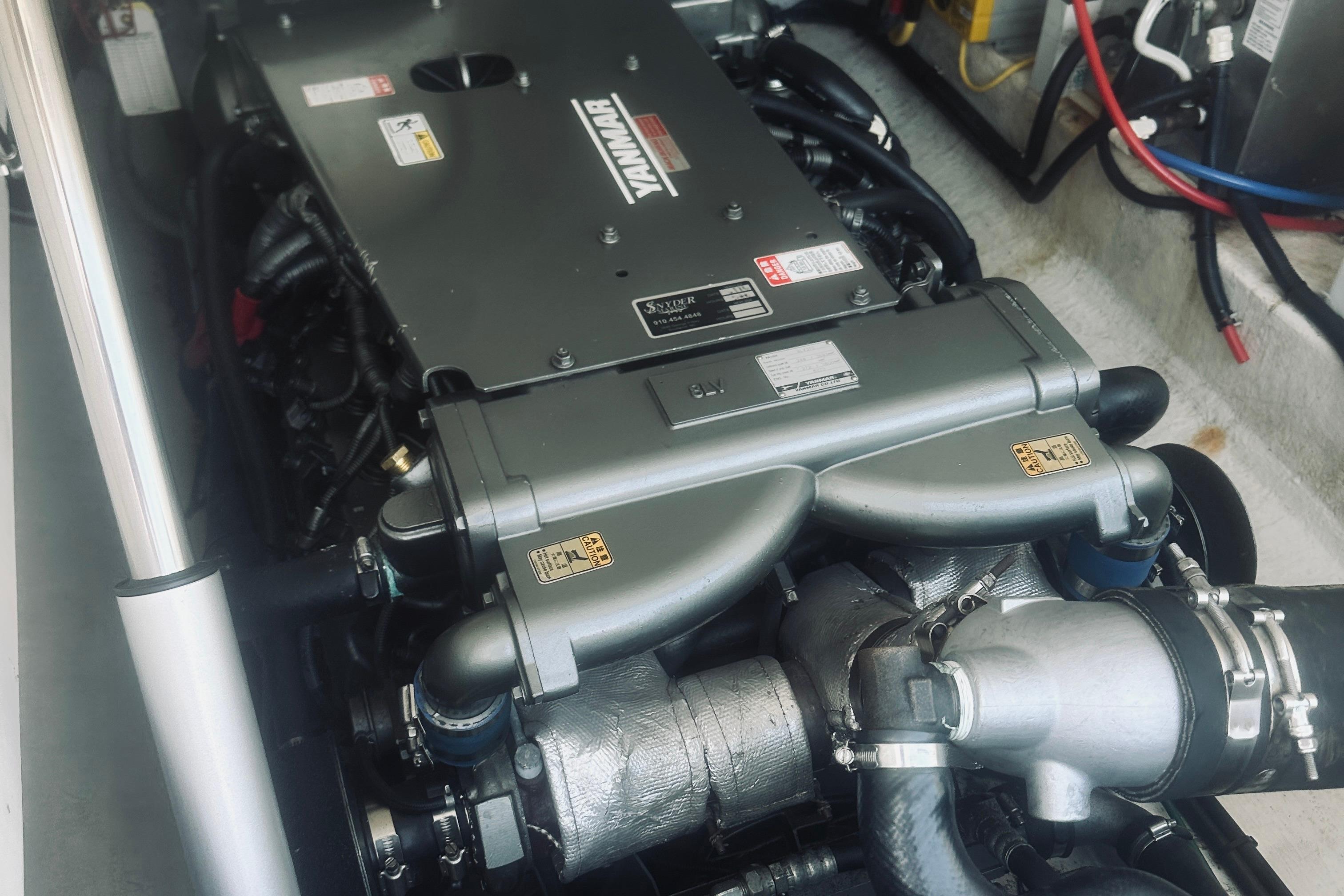 Engine compartment of a 2013 Back Cove 30 boat featuring a Yanmar engine.