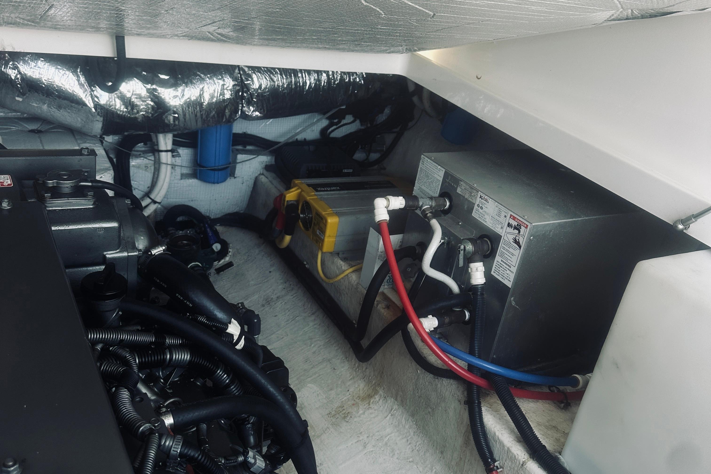 Engine compartment of a 2013 Back Cove 30 boat, showing mechanical components and wiring.