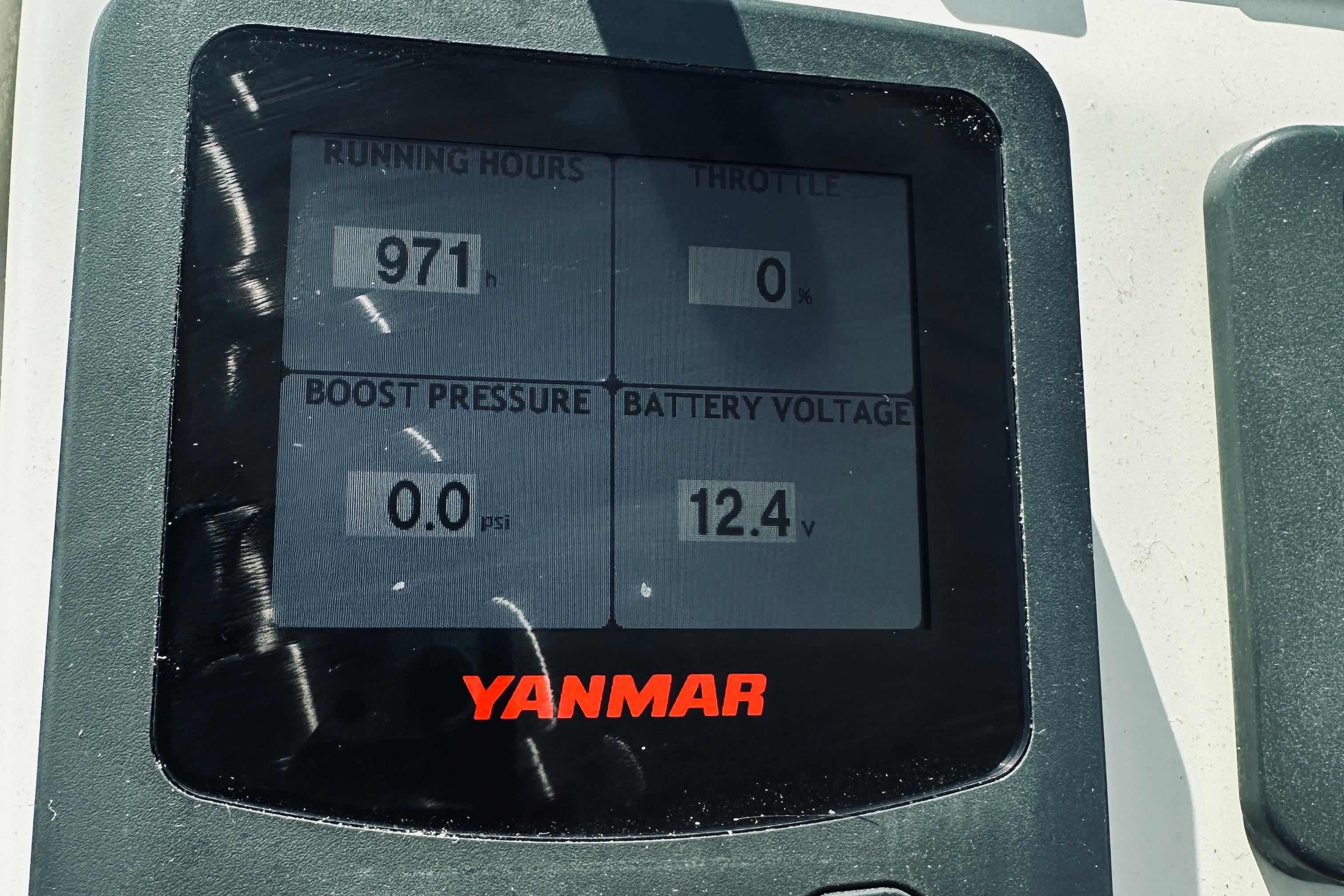 Yanmar engine display showing 971 running hours, 0% throttle, 0.0 psi boost, 12.4V battery. Back Cove 30, 2013.