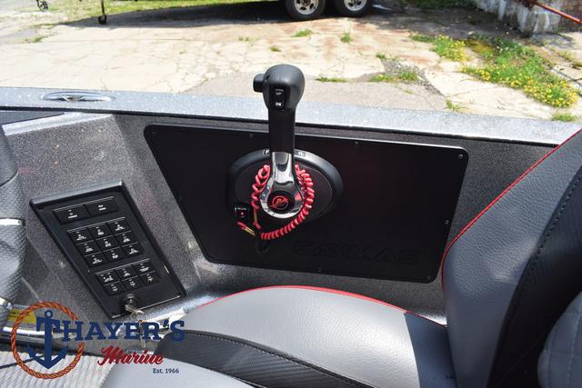 2023 Caymas CX20 Pro boat control panel with throttle and switches, Thayer's Marine logo visible.