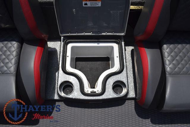 2023 Caymas CX20 Pro boat interior with storage compartment and cup holders.