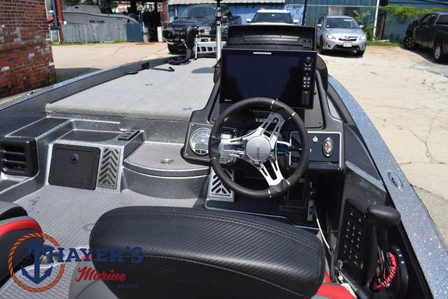 2023 Caymas CX20 Pro boat cockpit with steering wheel and control panel.