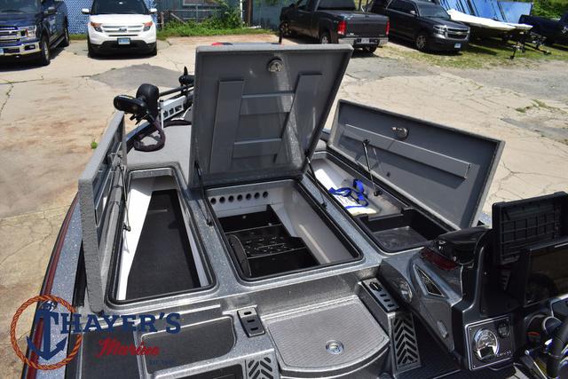 2023 Caymas CX20 Pro boat with open storage compartments and advanced dashboard features.