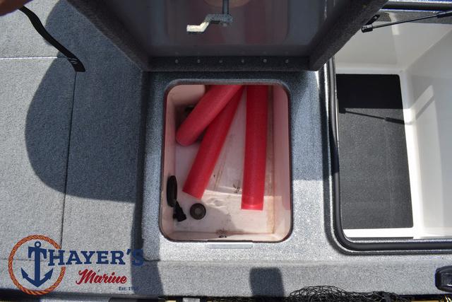 2023 Caymas CX20 Pro boat storage compartment with red pool noodles and Thayer's Marine logo.