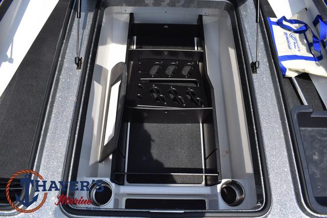 2023 Caymas CX20 Pro boat storage compartment with rod holders and accessories.