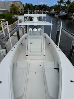 SeaVee-340Z 2024-REEL CRAFT FL-US-2024 SeaVee 340Z boat docked in a marina, showcasing sleek design and spacious deck.-9768819 | Thumbnail