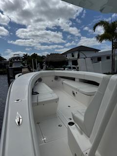 SeaVee-340Z 2024-REEL CRAFT FL-US-2024 SeaVee 340Z boat docked under a partly cloudy sky.-9768819 | Thumbnail