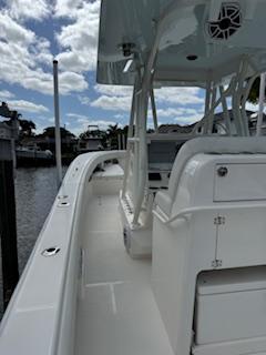 SeaVee-340Z 2024-REEL CRAFT FL-US-2024 SeaVee 340Z boat docked, showcasing sleek design and spacious deck under a partly cloudy sky.-9768819 | Thumbnail