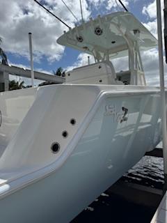 SeaVee-340Z 2024-REEL CRAFT FL-US-2024 SeaVee 340Z boat docked under a cloudy sky.-9768819 | Thumbnail