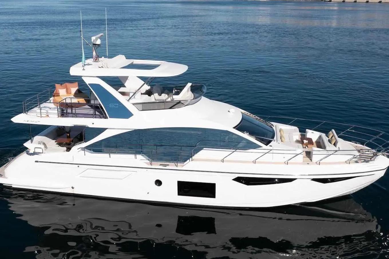 Luxury 2020 Azimut 60 yacht on calm blue water, showcasing sleek design and spacious decks.