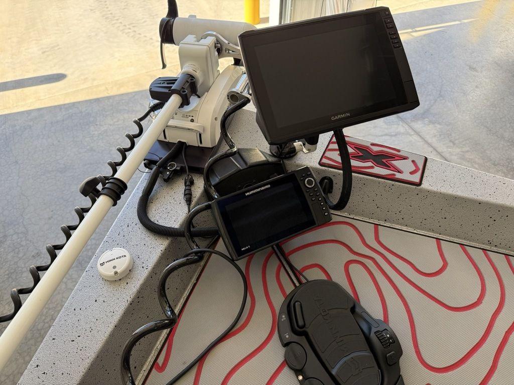 2024 Xpress H22B boat dashboard with Garmin electronics and trolling motor.