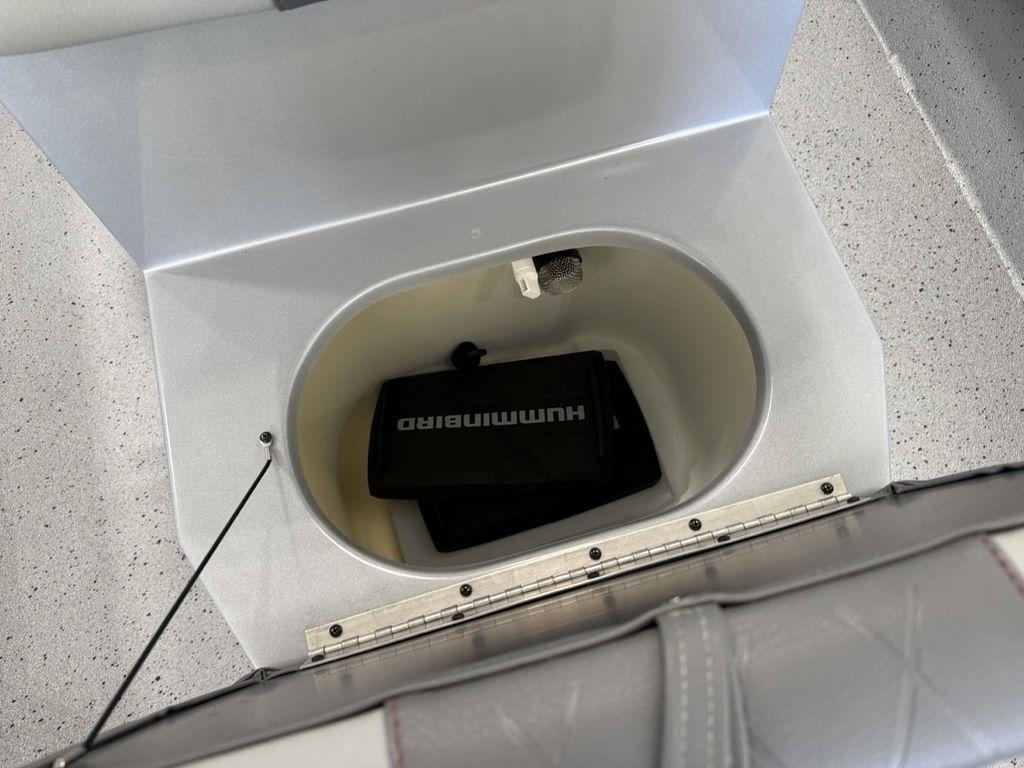 2024 Xpress H22B boat compartment with Humminbird equipment inside.