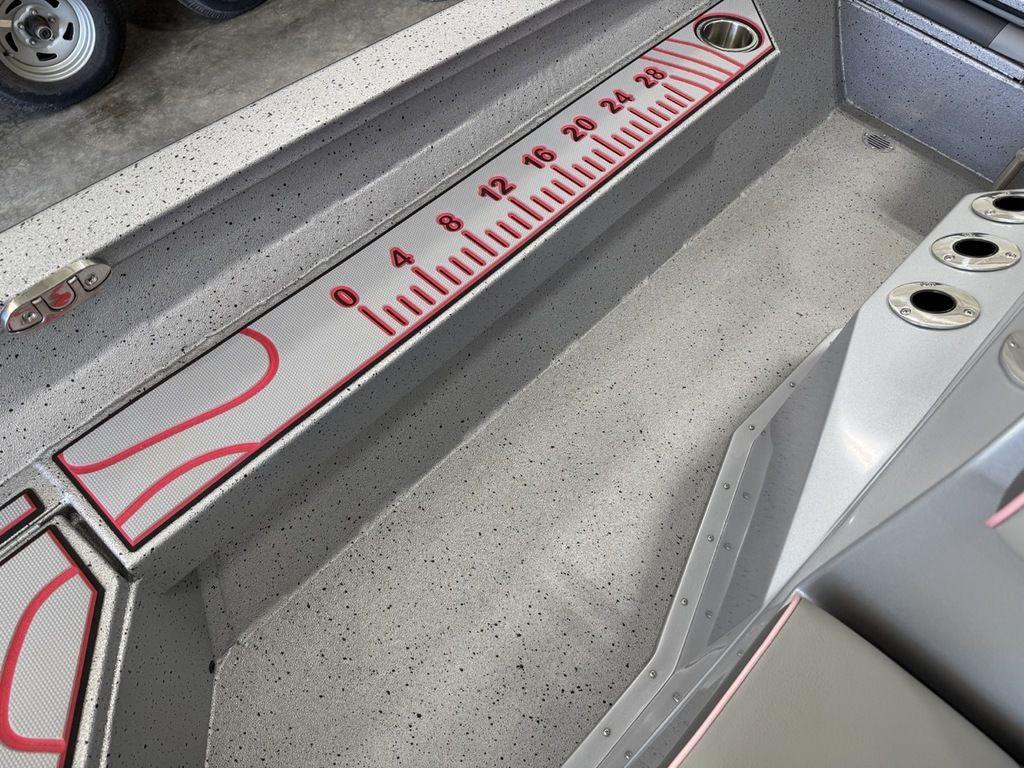 2024 Xpress H22B boat interior with built-in measuring ruler and cup holders.