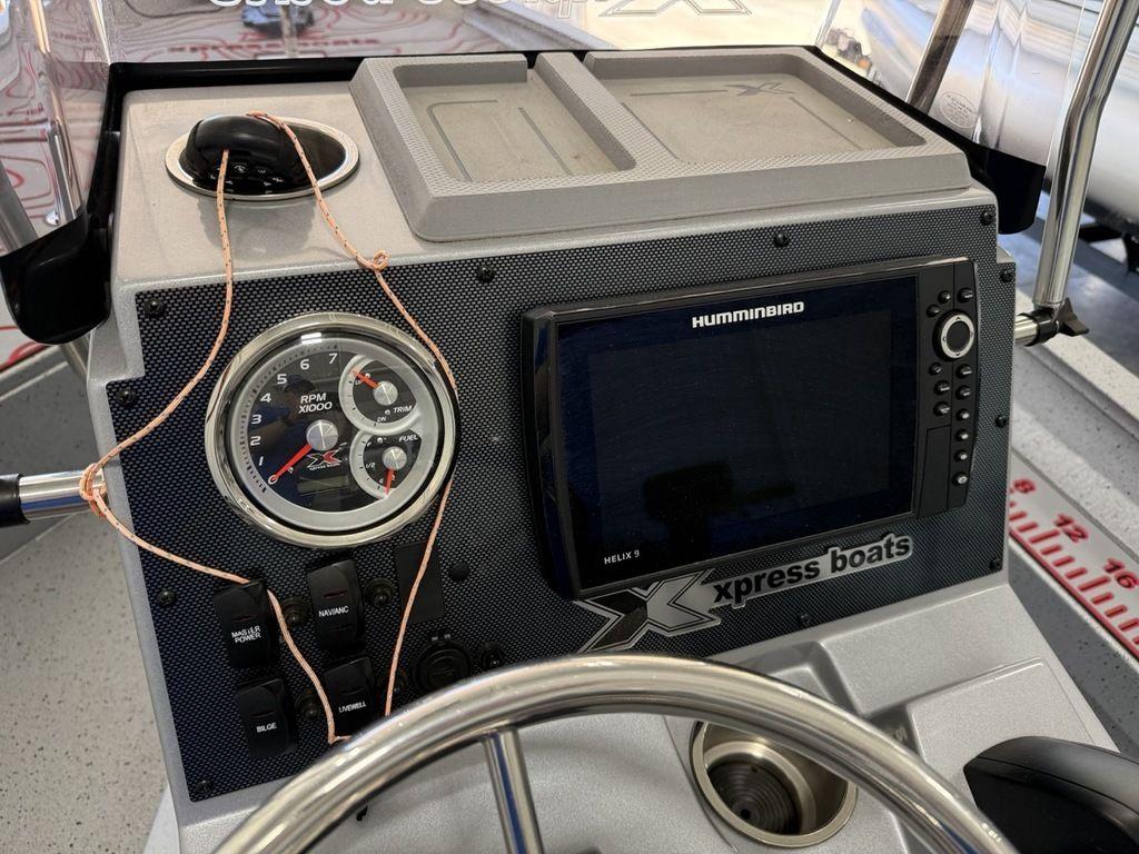 2024 Xpress H22B boat dashboard with Humminbird display and speedometer.