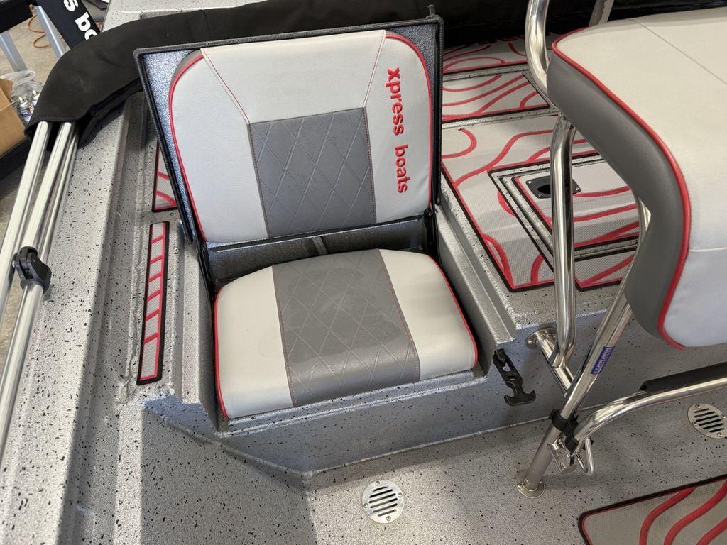 2024 Xpress H22B boat seat with storage, featuring gray and red accents.