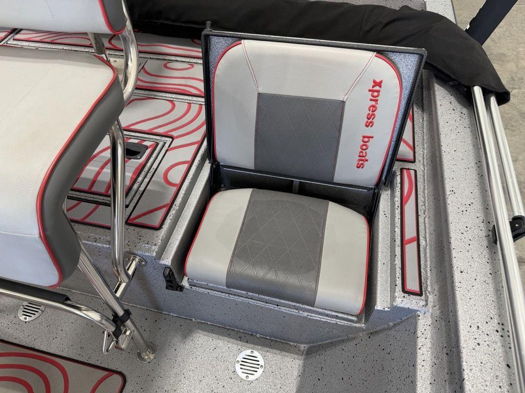 2024 Xpress H22B boat seat with storage, featuring gray and red design.