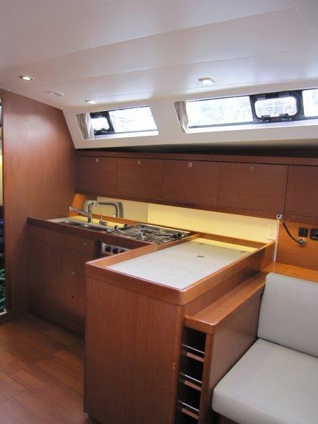 Beneteau-Oceanis 45 2015-Hey Jude III WA-US-Interior of 2015 Beneteau Oceanis 45 yacht, featuring a modern kitchen with wood cabinetry.-9598888 | Thumbnail